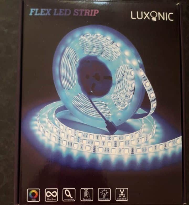 A flexible LED strip roll illuminated in blue, showcasing its features.