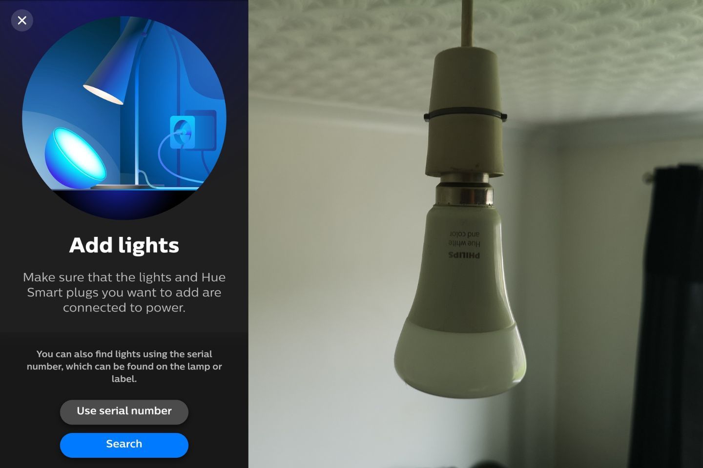 A hanging Philips hue light bulb in a room setting.