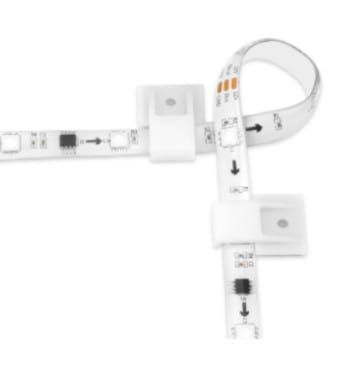 Flexible LED strip light with connectors and directional arrows.