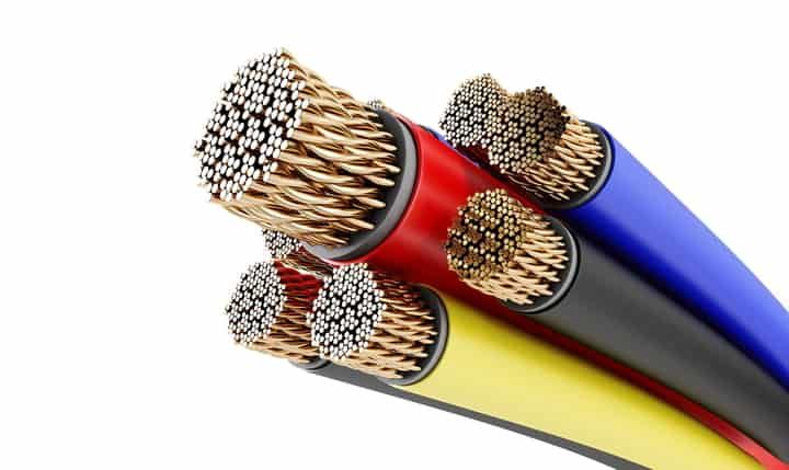 Close-up view of multiple colorful electrical cables with exposed copper strands.