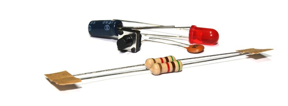 Assorted electronic components including capacitors, resistors, and a diode.