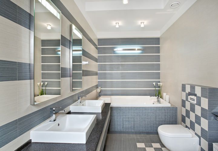 Modern bathroom featuring sleek fixtures, LED lighting, and stylish tile patterns.