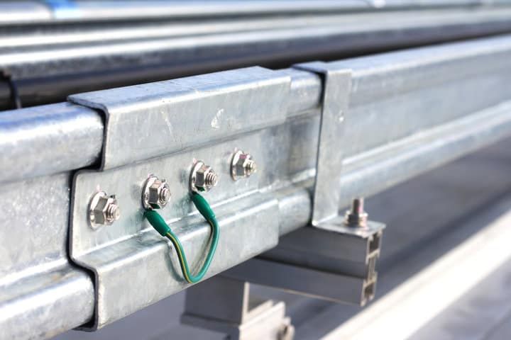 Close-up of metal frame with wires and connectors for LED lighting system.