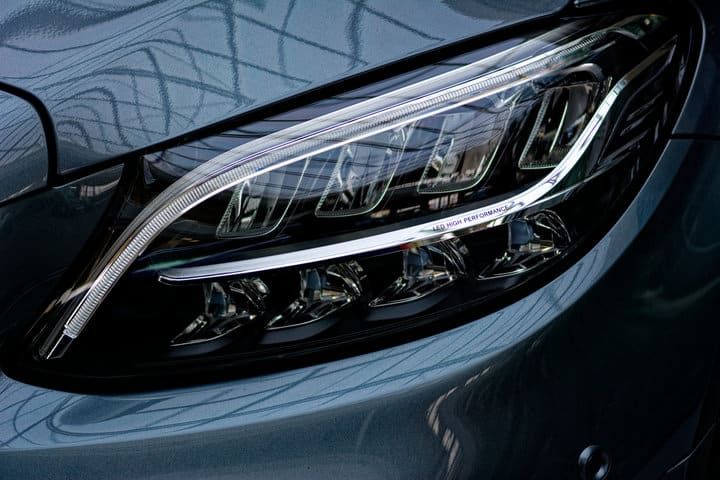 Close-up of a modern car's sleek LED headlight design.