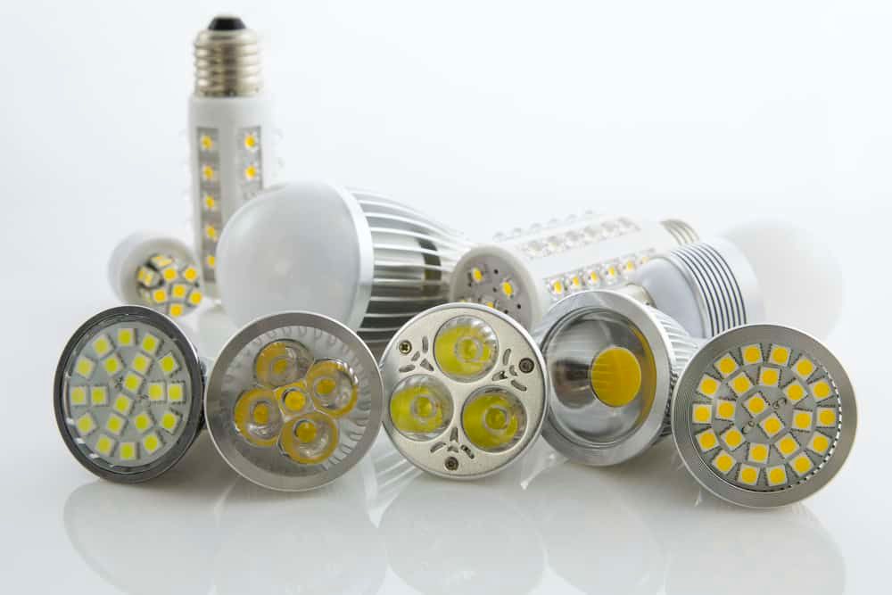 Variety of LED light bulbs in different shapes and designs on a white background.