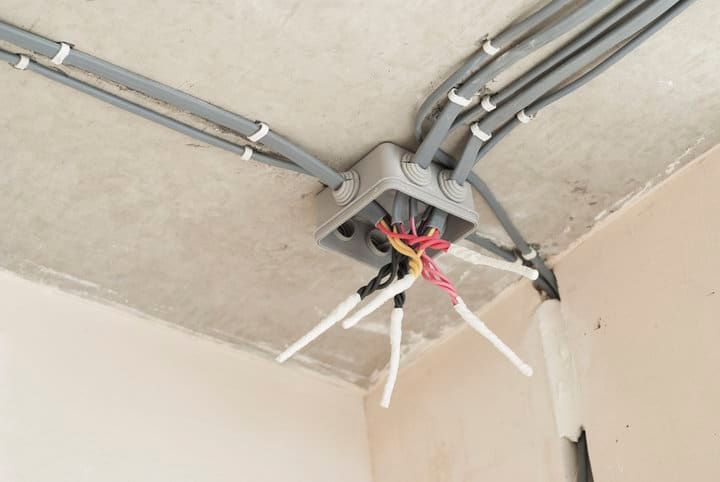 Wiring and junction box installed on a ceiling for LED lighting.