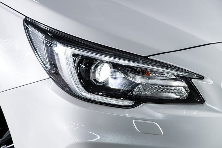 Close-up of a modern car headlight showcasing advanced LED lighting technology.