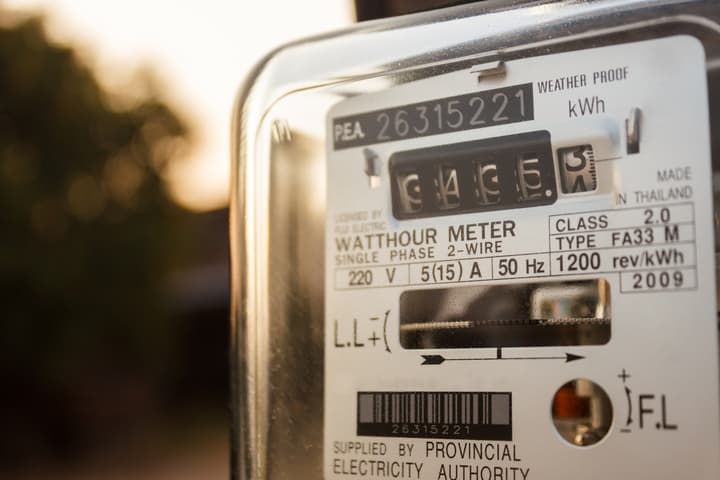 Close-up of a watthour meter displaying electrical usage readings.