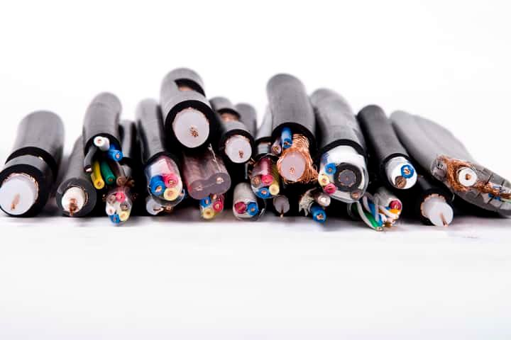 Various electric cables with exposed colored wires, arranged horizontally.