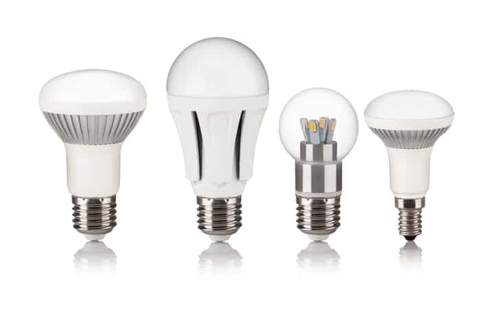 Four different styles of LED light bulbs arranged in a row.
