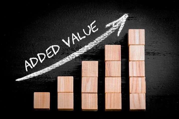Wooden blocks arranged in ascending bar chart with added value text.