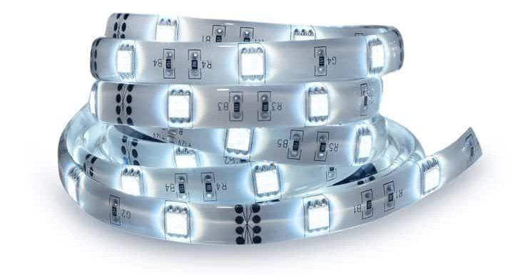 Coiled LED light strip with bright white lights glowing along the strip.