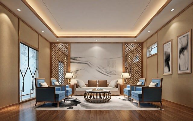 Modern living room with stylish blue chairs and elegant lighting.