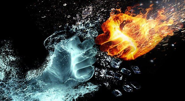 A dynamic visual of a fist made of ice clashing with a fiery fist.