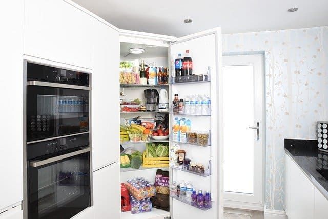A well-organized refrigerator filled with various food and drink items.
