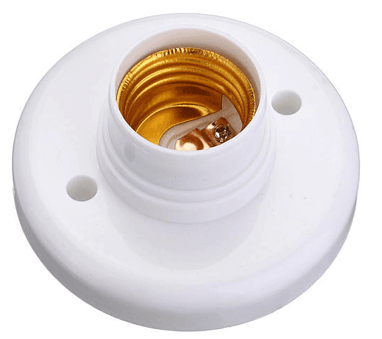 Close-up of a white light bulb socket with a gold interior.