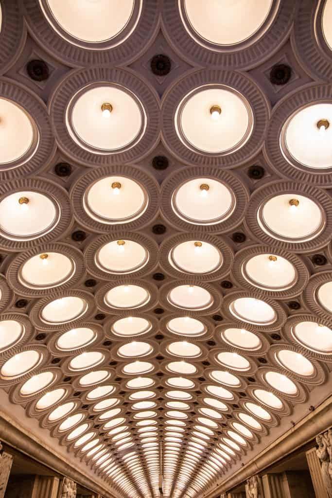 A ceiling lined with round LED lights creating a modern, illuminated design.