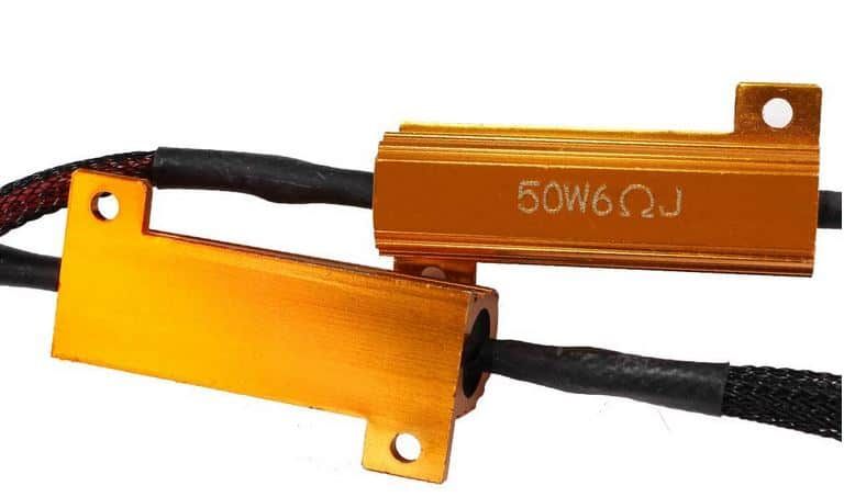 Two orange aluminum resistors with black wires, labeled with a resistance value.