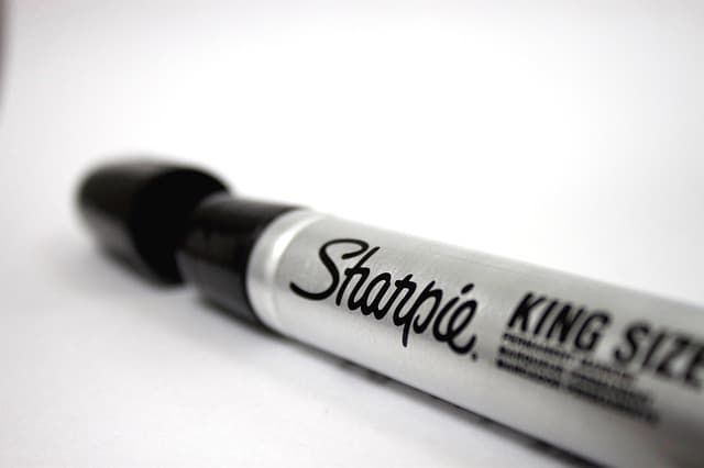 Close-up of a Sharpie King Size marker on a white background.